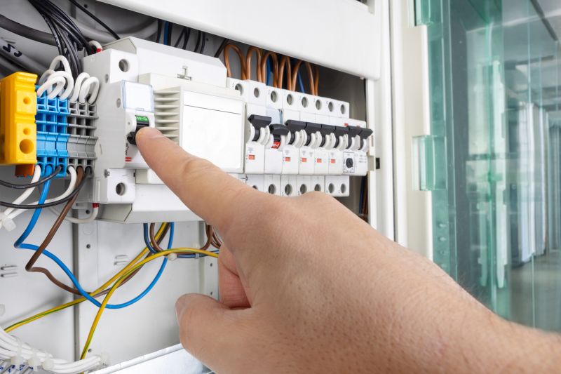 Electrician Working on Circuit Breaker